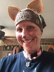 Kim as a feral cat, MCing the event