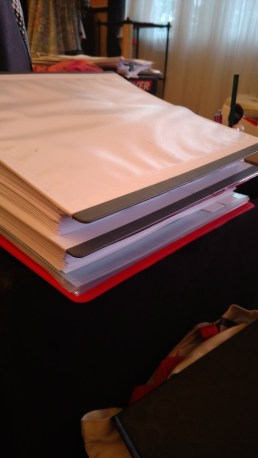 Top binder, A CHRISTMAS PERIL, ready for copy edits final round. Bottom binder, WITH A KISS I DIE, ready for first read before I send it out.